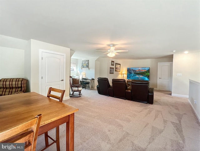 living room featuring ceiling fan and light carpet