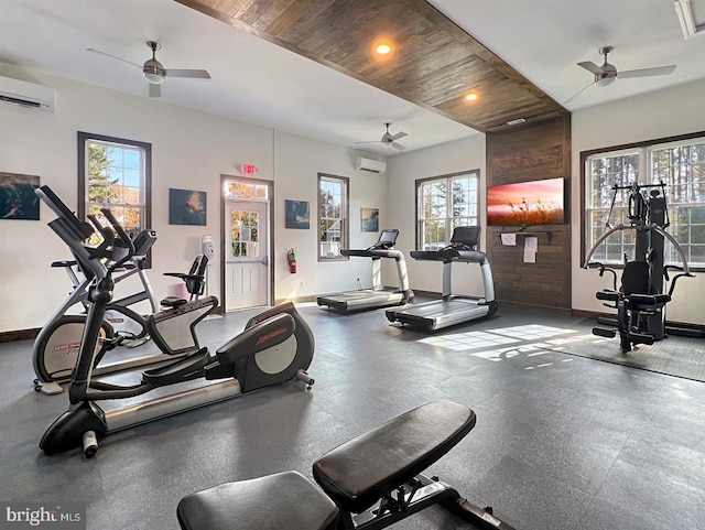 exercise room with a wall unit AC, wooden ceiling, and ceiling fan