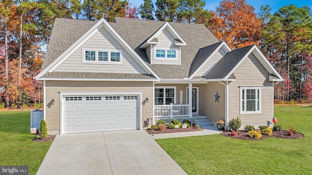 craftsman inspired home featuring a garage, a porch, and a front yard