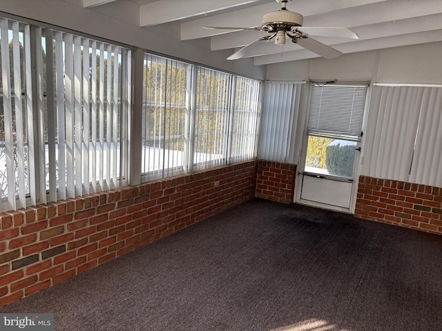 unfurnished sunroom with beamed ceiling and ceiling fan