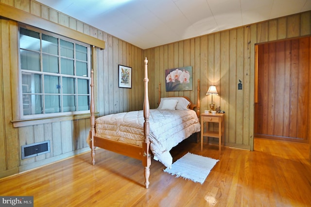 bedroom with visible vents and wood finished floors