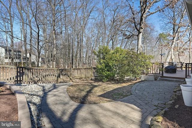 view of yard with fence and a deck