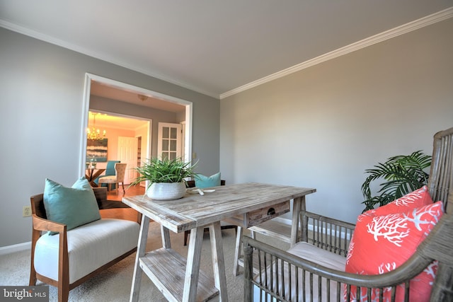 interior space with crown molding, a notable chandelier, and baseboards