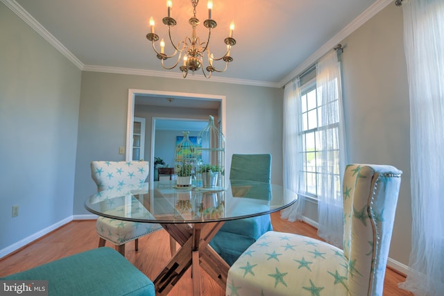 dining area featuring baseboards and wood finished floors