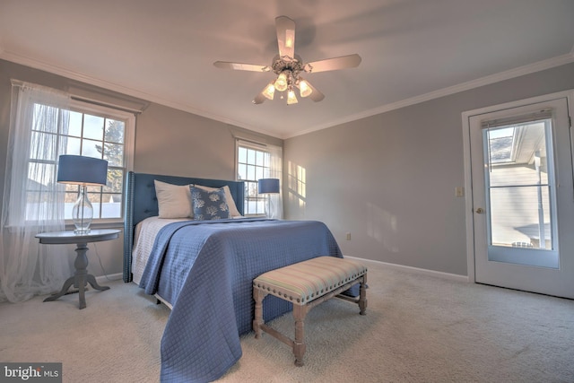 bedroom featuring carpet floors, baseboards, ornamental molding, and a ceiling fan