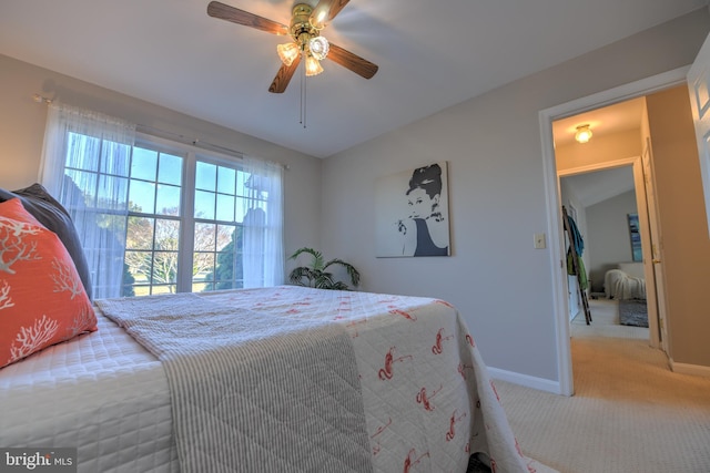 bedroom featuring carpet floors, a ceiling fan, and baseboards