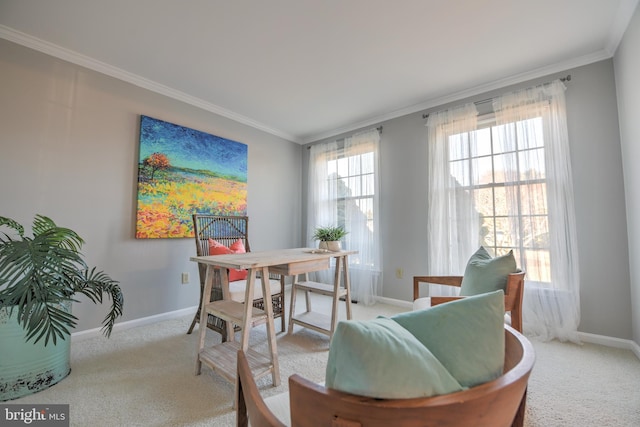 carpeted dining room with ornamental molding, plenty of natural light, and baseboards