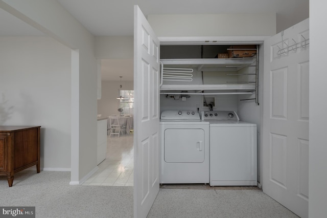 laundry room with washing machine and dryer