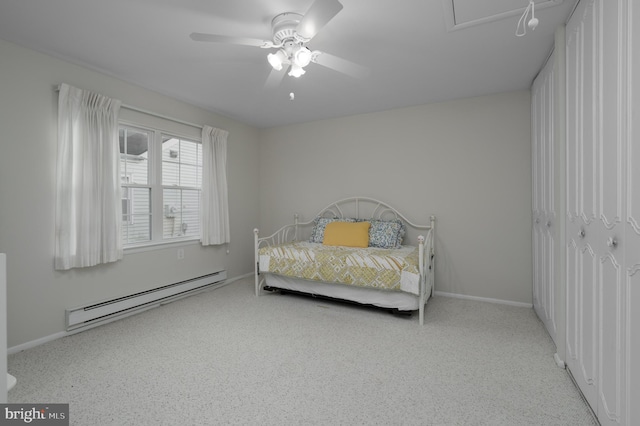 carpeted bedroom featuring ceiling fan and baseboard heating