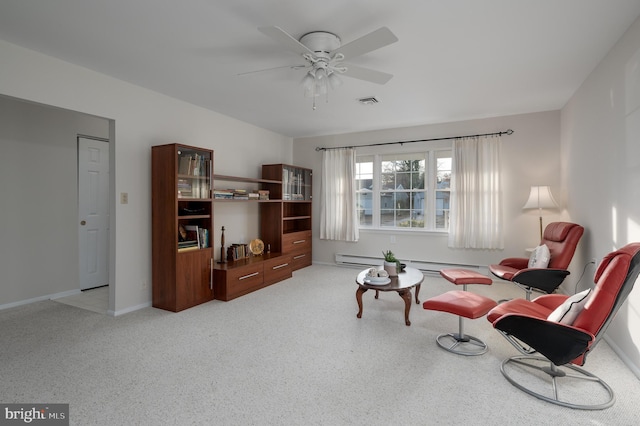 sitting room featuring baseboard heating and ceiling fan