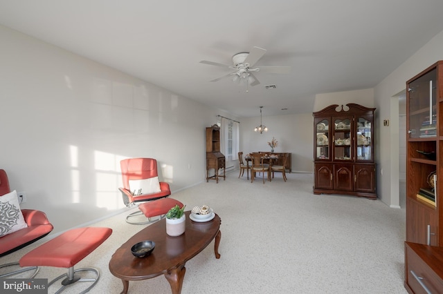 carpeted living room featuring ceiling fan