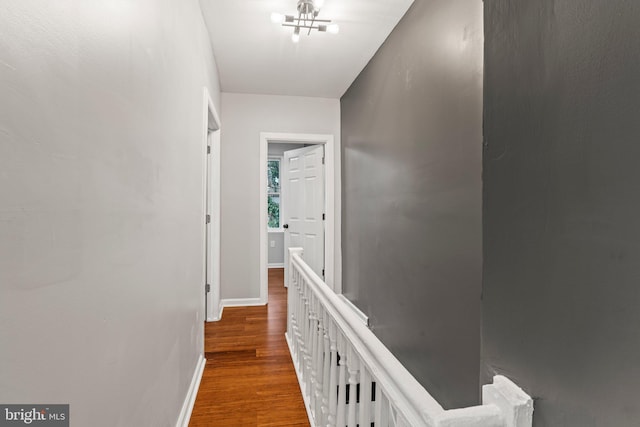 corridor with hardwood / wood-style floors