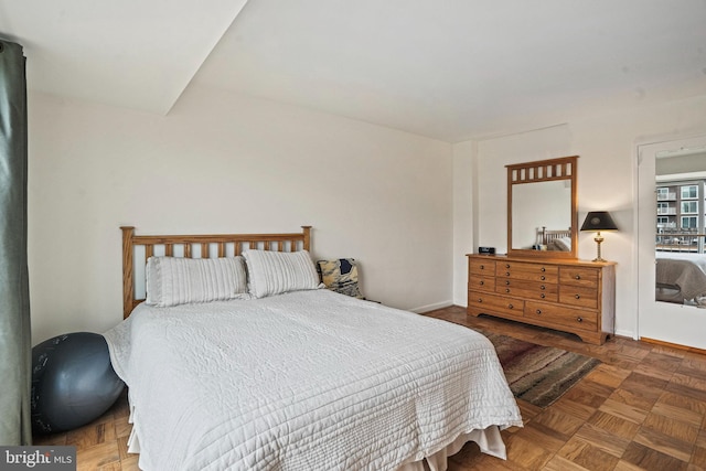 bedroom with dark parquet floors