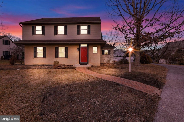 traditional-style house with stucco siding