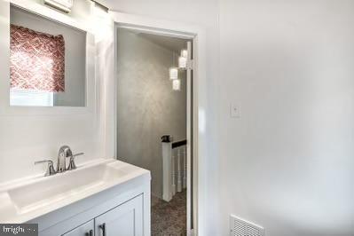 bathroom with visible vents and vanity