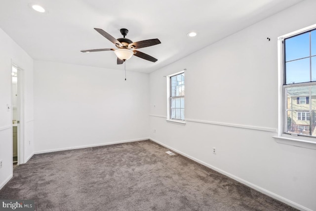 unfurnished room with a ceiling fan, carpet, visible vents, baseboards, and recessed lighting