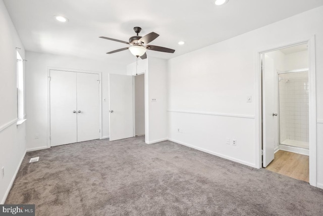 unfurnished bedroom featuring recessed lighting, a closet, carpet, and ensuite bathroom