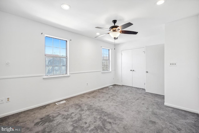 unfurnished bedroom with carpet flooring, recessed lighting, and visible vents