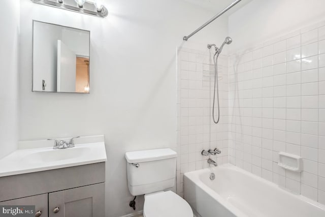 bathroom with vanity, toilet, and shower / bath combination