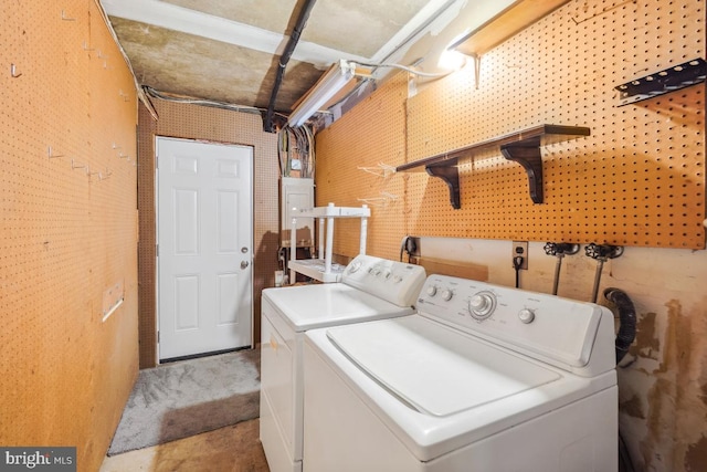 washroom featuring washer and dryer and laundry area