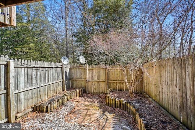 view of yard with a fenced backyard