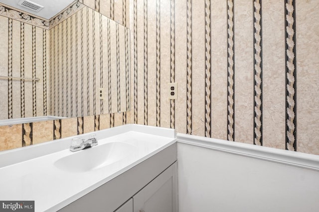 bathroom featuring vanity and visible vents