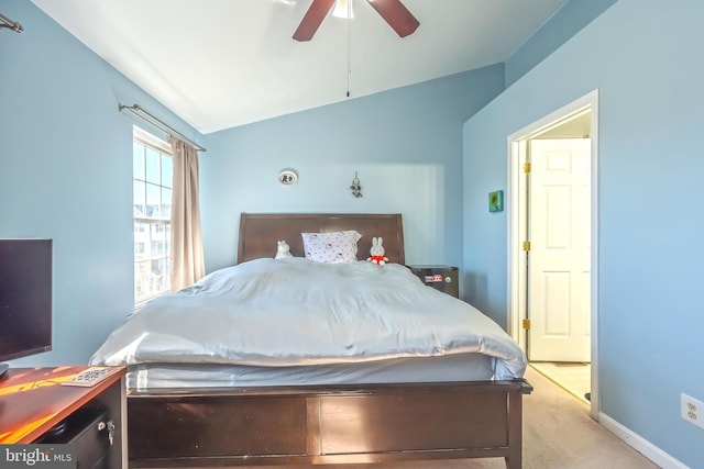 bedroom with lofted ceiling, carpet flooring, baseboards, and ceiling fan