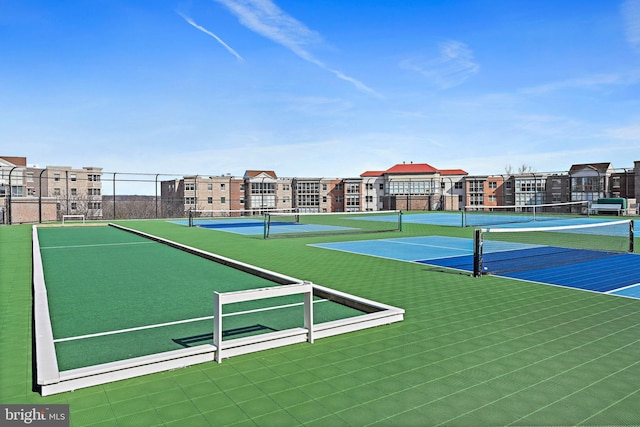 view of sport court with community basketball court and fence