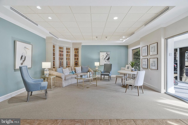 living area featuring recessed lighting, baseboards, crown molding, and light colored carpet