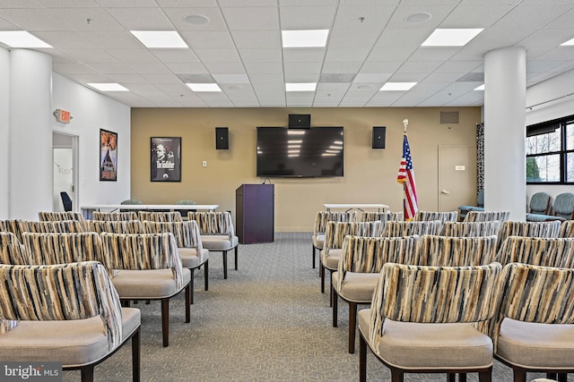 interior space with light carpet, visible vents, and a paneled ceiling