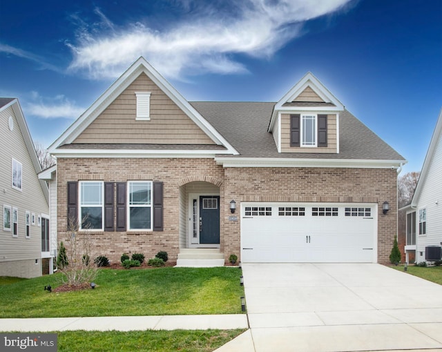 craftsman house with a garage, a front yard, and central air condition unit