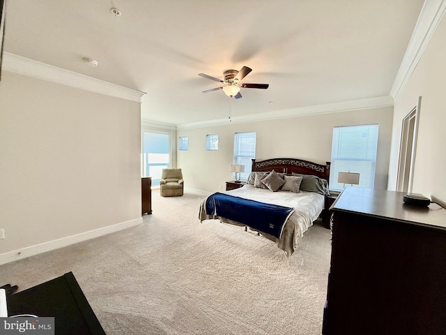 carpeted bedroom with multiple windows, ornamental molding, and ceiling fan