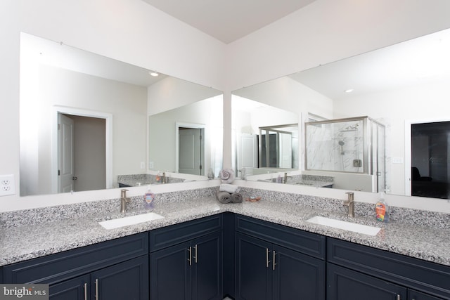 bathroom featuring vanity and walk in shower