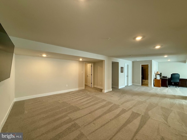 basement with light colored carpet