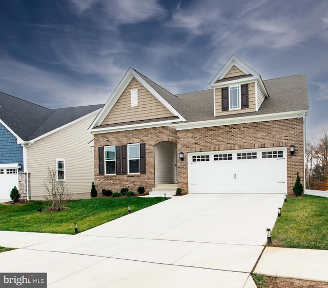 craftsman house featuring a garage and a front lawn