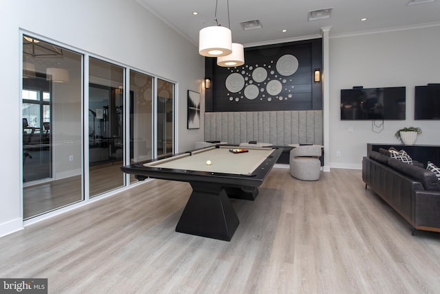 game room with pool table, crown molding, and light hardwood / wood-style floors