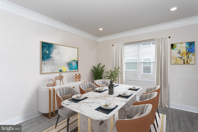 dining area featuring crown molding and dark wood-type flooring