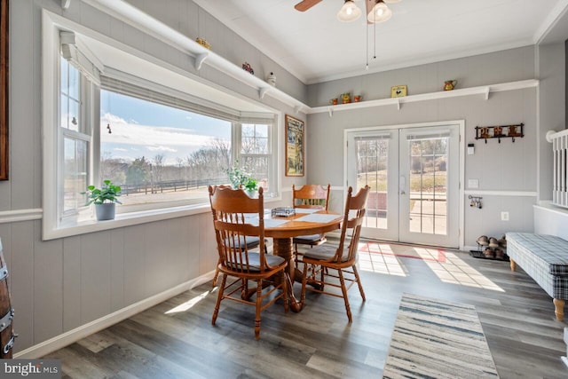 dining room with a ceiling fan, wood finished floors, french doors, and a healthy amount of sunlight