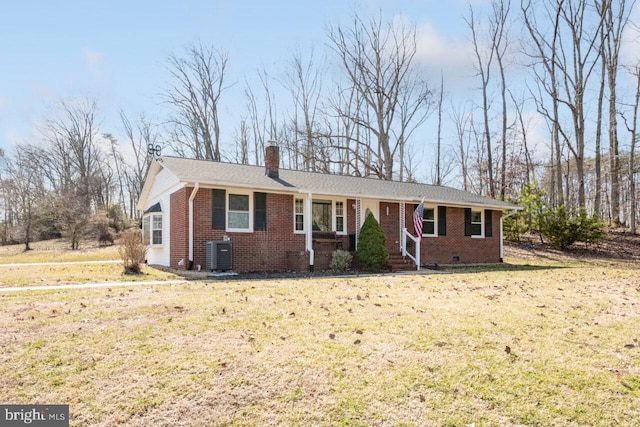 ranch-style house with a chimney, a front lawn, crawl space, central air condition unit, and brick siding