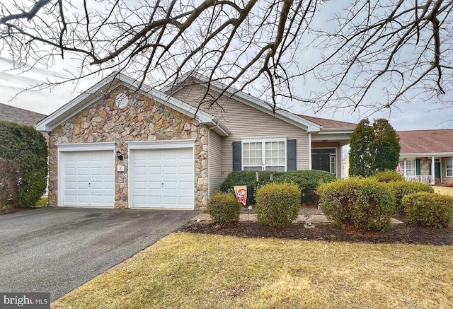 single story home with a garage and a front yard