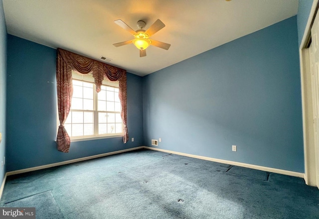 carpeted empty room with ceiling fan