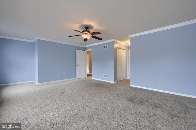 carpeted empty room with ornamental molding and ceiling fan