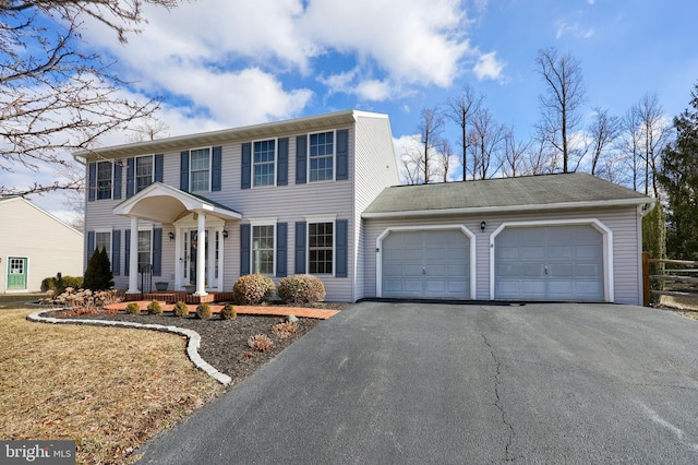 colonial inspired home with a garage