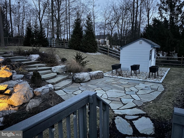 view of patio with a shed