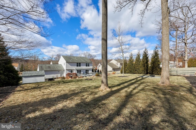 back of property with a lawn