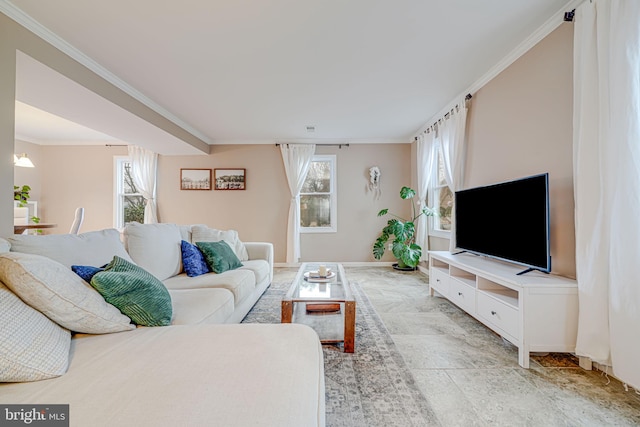 living area featuring crown molding and baseboards