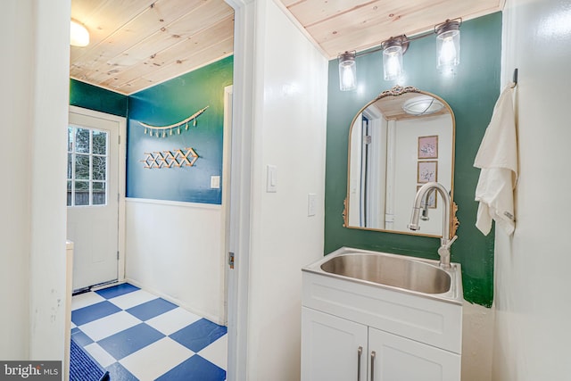 bathroom with vanity, wood ceiling, and tile patterned floors