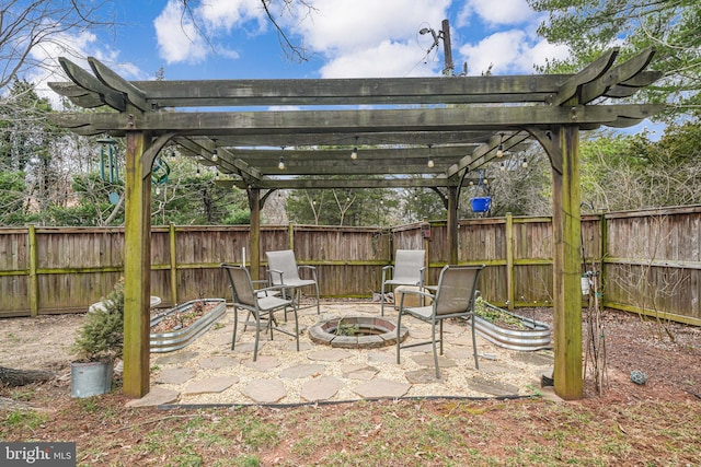 view of patio featuring an outdoor fire pit, a pergola, and a fenced backyard