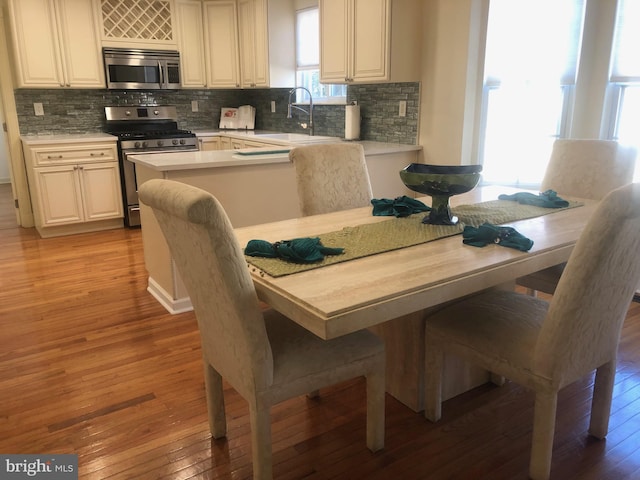 dining area with light wood-style floors