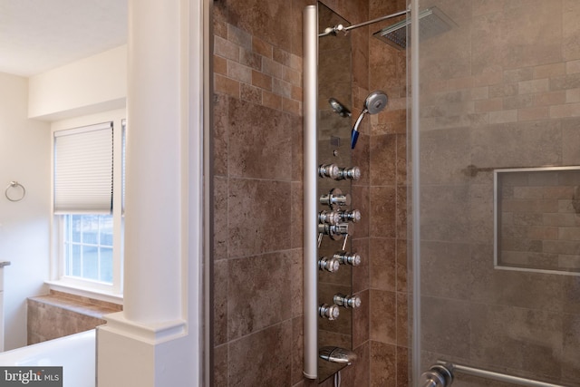 bathroom with tiled shower
